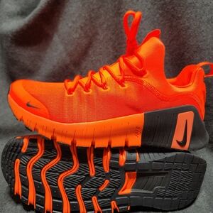 Nike Free Metcon 6 training shoe in a bright orange and black 11M